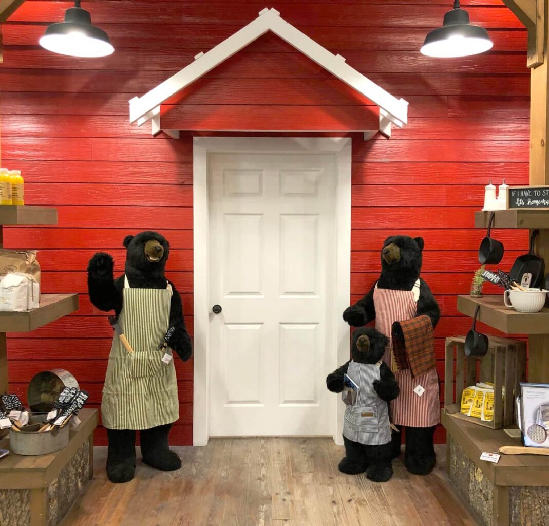 Three bear mannequins in the Appalachian Store among souvenirs.
